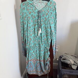 Floral Teal Romper with Tassel Accents
